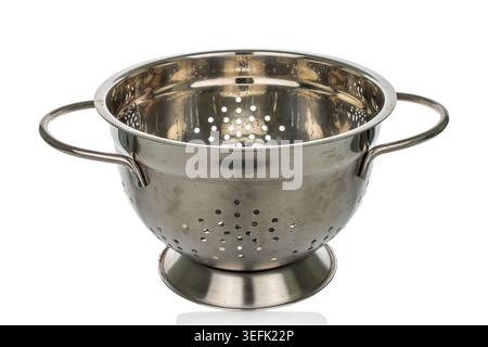 Metal colander isolated on white background, close-up. Stock Photo