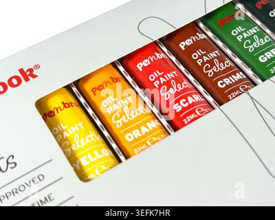 Close up of Pembrook brand oil paint selection tubes in packaging showing yellow orange scarlet crimson and green colors Stock Photo