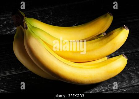 banana on black wood background Stock Photo