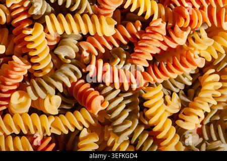 tri color pasta texture background top view Stock Photo