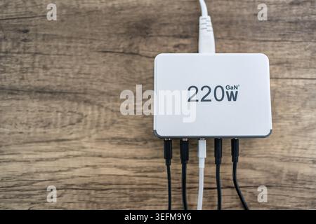 Multi charger with multiple outputs of different types in photo co copyspace. Stock Photo
