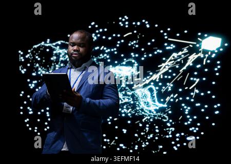 Software developer implementing deep learning algorithms for AI system using tablet app. African american man using device to build artificial intelligence neural network architecture Stock Photo