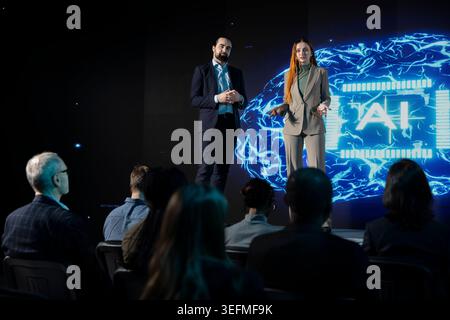 Artificial intelligence panel debate with experts discussing ai-powered solutions, neural networks and new technology. Diverse participants attend business conference for investments. Stock Photo