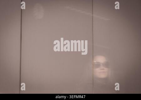 Translucent Glass Textured Frosted textured glass with a soft human silhouette and warm light ...