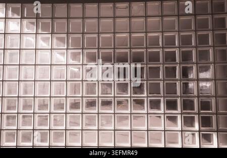 Glass block wall creating geometric abstract pattern Stock Photo
