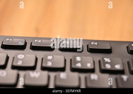 Minimal Black Keyboard Macro Compositions Highlighting F3 Function Key in Soft Focus Angled Top View Stock Photo