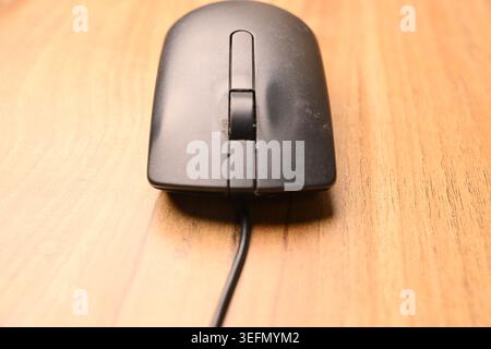 Black Computer Mouse, Front View Close-Up Macro Photograph with Soft Defocused Backgrounds and Minimal Tech Composition Stock Photo
