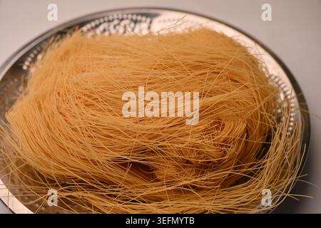 Fried Semiya in Steel Plate with Defocus Backgrounds Macro Food Photography Stock Photo