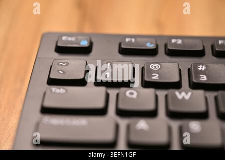 Minimal Black Keyboard Macro Compositions Highlighting 1 and Exclamation Mark Key in Soft Focus Angled Top View Stock Photo