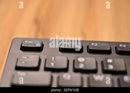 Minimal Black Keyboard Macro Compositions Highlighting F1 Function Key in Soft Focus Angled Top View Stock Photo