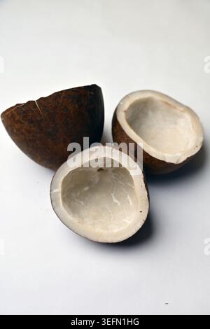 Dry Coconut Texture on White Background Angled Top View with Defocus Macro Photography Stock Photo