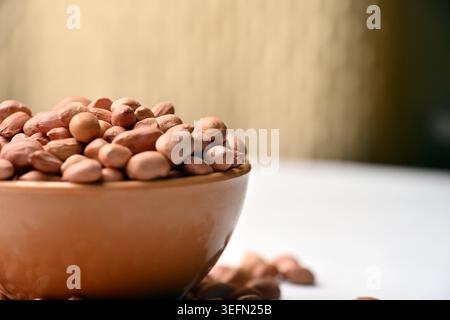 Peanuts in Bowl Front View with Defocus Backgrounds Macro Photography Stock Photo