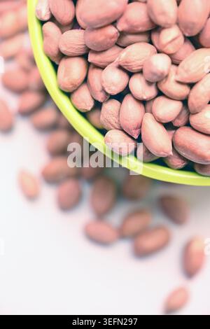 Peanuts in Bowl Top View with Defocus Backgrounds Macro Photography Vertical Image Stock Photo