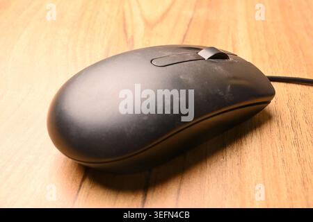 Black Computer Mouse, Angled Top View Close-Up Macro Photograph with Soft Defocused Backgrounds and Studio Lighting Stock Photo
