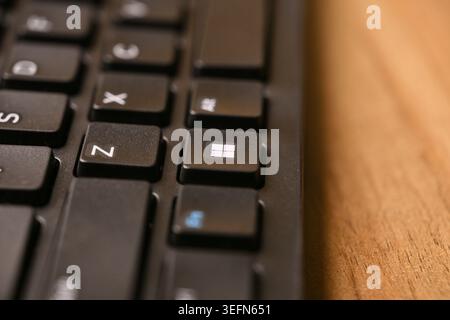 Side Angled Macro Close-Up of Black Computer Keyboard Keys with Shallow Depth of Field on Blurred Tech Backgrounds Stock Photo