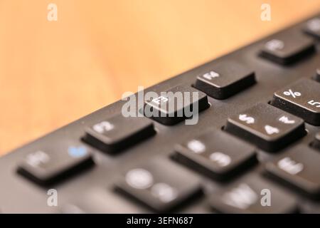Macro Angled Top View Black Computer Keyboard Highlighting F3 Function Key on Blurred Tech Backgrounds Stock Photo