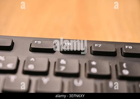 Minimal Black Keyboard Macro Compositions Highlighting F6 Function Key in Soft Focus Angled Top View Stock Photo