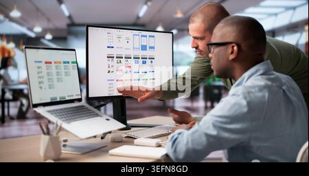 UX Designers Brainstorming Ideas Together To Improve App’s User Interface. Stock Photo