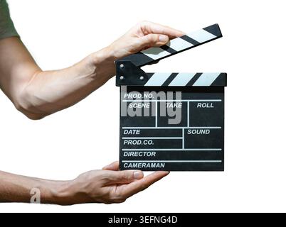 Man is holding clapper board in hand. Concept of filmmaking. Isolated on white background. Stock Photo