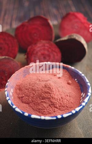 Beetroot powder and sliced beets on a wooden table Stock Photo