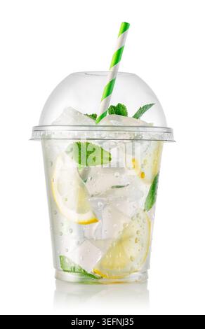 Lemonade or mojito style drink with lemon slices, ice cubes and fresh mint leaves in clear takeaway plastic cup isolated on white Stock Photo