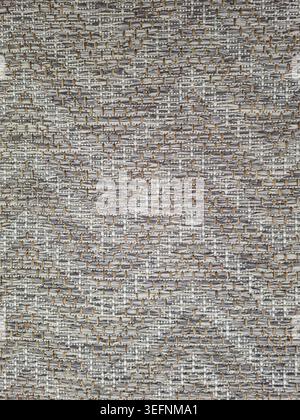 This close up reveals a grey woven fabric texture with a repetitive interlaced pattern. It is suitable for various textile design projects, including Stock Photo