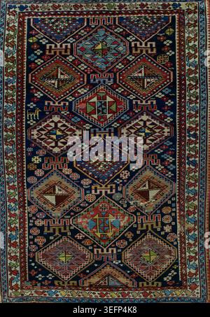 Authentic traditional Shakhnazarli carpet from the Shirvan group of Azerbaijan featuring intricate geometric ornaments, rich woven texture, and colorf Stock Photo