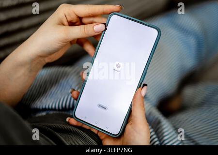 GNIEZNO, POLAND - May 06, 2026: Woman's Hands Holding Phone With Gpt Chat Icon On Screen Stock Photo
