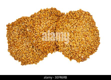 Pair of sesame covered cookies isolated on white background. Authentic Middle Eastern dessert concept, homemade bakery and oriental sweets photography Stock Photo