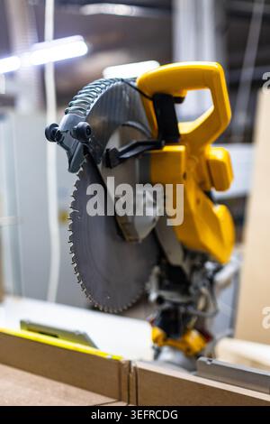 Professional Circular Miter Saw in Woodworking Workshop Stock Photo