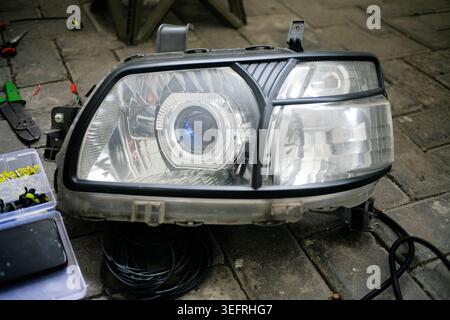 close up of car headlights dismantled on the floor Stock Photo