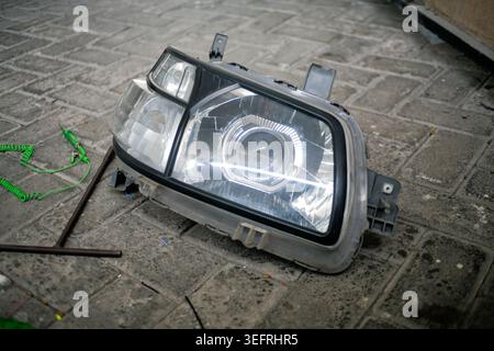 close up of car headlights dismantled on the floor Stock Photo