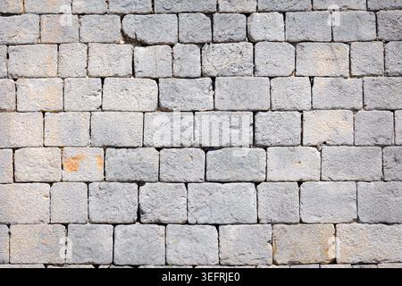 Square Grey Natural Stone Wall Texture Background. Stock Photo