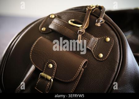 Close Up of Brown Leather Travel Bag with Buckles Stock Photo