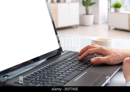 Closeup of hands typing on laptop with isolated screen in bright office environment, suitable for software mockups, business presentations and digital Stock Photo