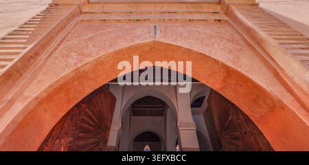 Close up, low angle shot of a typical sandstone archway in the Marrakech Medina, Morocco Stock Photo
