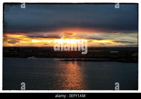 Fiery Horizon Over the Waters of Moses Lake Stock Photo
