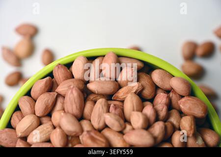 Peanuts in Bowl Top View with Defocus Backgrounds Macro Photography Stock Photo