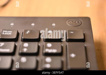 Minimal Black Keyboard Macro Compositions Highlighting Asterisk Key on Numeric Keypad in Soft Focus Angled Top View Stock Photo