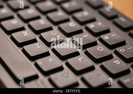 Minimal Cinematic Keyboard Macro Shot Featuring K Key in Side Angled Top View with Soft Focuss Stock Photo