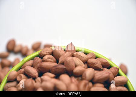 Peanuts in Bowl Top View with Defocus Backgrounds Macro Photography Stock Photo