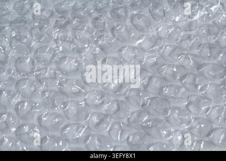 Full frame background texture of clear plastic bubble wrap packaging material Stock Photo