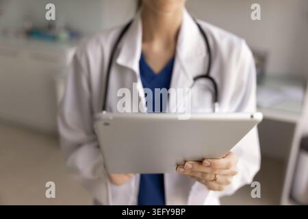 Closeup shot of female doctor using digital tablet Stock Photo