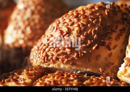 Freshly baked bread with sesame seeds in sunlight Stock Photo
