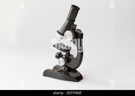 Black microscope isolated on white background with laboratory equipment details Stock Photo
