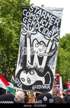 Protesters, some wearing face coverings, march through a street as a ...