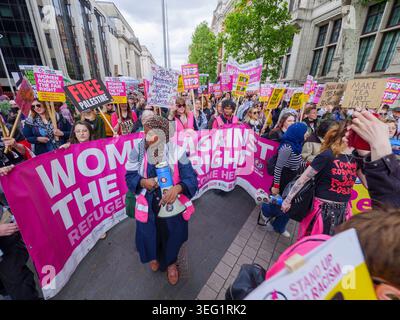 London, UK. 16 May 2026. Pro-Palestinian demonstrators gather on Exhibition Road in Kensington during a march marking the 78th anniversary of Nakba Day. Members of Women Against the Right carry a striking pink banner and placards as crowds join a large coalition-led demonstration that significantly outnumbered a simultaneous far-right “Unite the Kingdom” rally in central London Stock Photo