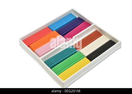 Children's plasticine of various colors in a box isolated on a white background. Stock Photo
