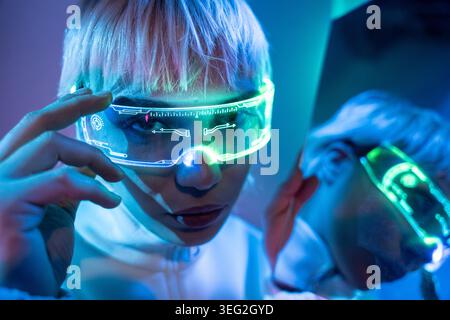 Close-up of a futuristic woman wearing a glowing smart visor, adjusting augmented reality display in a neon cyberpunk lab, showcasing wearable tech, A Stock Photo