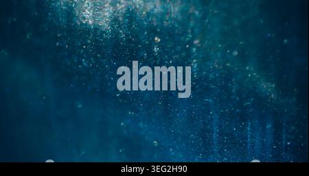 Shimmering blur blend. Glowing wave. Blue gray sparkling leak stream. Color bokeh particles floating abstract background reflection. Stock Photo